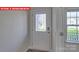 Interior entryway with decorative glass front door, white walls and view through window at 7330 Stonehouse Dr, Gastonia, NC 28056