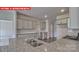 This spacious kitchen features gray cabinets, stainless steel appliances, and a large island with a sink at 7330 Stonehouse Dr, Gastonia, NC 28056