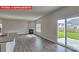 A spacious living room and kitchen area with an island, fireplace, and stainless steel appliances at 7330 Stonehouse Dr, Gastonia, NC 28056