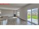 Bright living room features a cozy fireplace and sliding doors to the backyard patio at 7330 Stonehouse Dr, Gastonia, NC 28056
