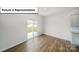 Bright dining area with sliding glass doors, and seamless flow into the kitchen at 7747 Woolsey Dr, Gastonia, NC 28056