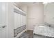 Cozy bathroom with a granite countertop vanity and a shower with a striped curtain at 829 River Park Rd, Belmont, NC 28012