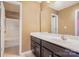 Bathroom features a vanity with dark cabinets and a shower at 9013 Gailes Dr, Charlotte, NC 28278