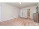 Neutral bedroom featuring a dresser and two doorways at 9013 Gailes Dr, Charlotte, NC 28278