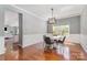 Elegant dining room featuring a round table, stylish chairs, and sophisticated decor at 9013 Gailes Dr, Charlotte, NC 28278