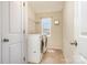Laundry room features a washer and dryer and built-in shelving at 9013 Gailes Dr, Charlotte, NC 28278