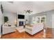 Cozy living room with a fireplace, hardwood floors, and lots of natural light at 9013 Gailes Dr, Charlotte, NC 28278