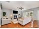 Inviting living room with a fireplace, hardwood floors, and plenty of natural light at 9013 Gailes Dr, Charlotte, NC 28278