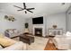 Stylish living room with hardwood floors, fireplace, and modern ceiling fan at 9013 Gailes Dr, Charlotte, NC 28278