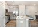 Bright, modern kitchen with stainless steel appliances and a large island with breakfast bar at 9654 Old Garden Cir, Gastonia, NC 28056