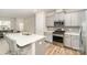 Modern kitchen boasts stainless steel appliances and a spacious island with bar seating at 9654 Old Garden Cir, Gastonia, NC 28056