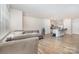 Spacious open-concept living room leads into the modern kitchen, creating the perfect flow at 9654 Old Garden Cir, Gastonia, NC 28056