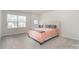 Serene main bedroom with soft carpeting, a large window, and ample natural light at 9654 Old Garden Cir, Gastonia, NC 28056