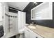 Updated bathroom with tiled shower and modern vanity at 9718 Barkridge Rd, Mint Hill, NC 28227