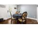 Dining room with a round table, stylish chairs, and natural light from a nearby door at 9718 Barkridge Rd, Mint Hill, NC 28227
