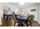 Dining area next to the kitchen with dark wood floors and a view of the backyard at 9718 Barkridge Rd, Mint Hill, NC 28227
