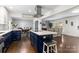 Open-concept kitchen with a large island that flows into the dining and living areas at 9718 Barkridge Rd, Mint Hill, NC 28227