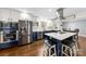 Modern kitchen with stainless steel appliances, island and stylish cabinetry at 9718 Barkridge Rd, Mint Hill, NC 28227