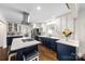 Spacious kitchen featuring a central island with seating, stainless appliances, and a view of the laundry room at 9718 Barkridge Rd, Mint Hill, NC 28227