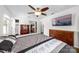 Spacious main bedroom with ceiling fan and ensuite bathroom at 9718 Barkridge Rd, Mint Hill, NC 28227
