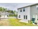 Backyard with concrete patio and lawn, perfect for outdoor entertaining and relaxation at 10002 Brittondale Ln, Charlotte, NC 28215