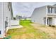 Backyard with a concrete patio, lawn and view of the neighborhood at 10002 Brittondale Ln, Charlotte, NC 28215