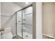 Full bathroom featuring glass enclosed shower and updated fixtures at 10002 Brittondale Ln, Charlotte, NC 28215