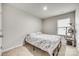 Bedroom with a bed and a cat tree near the window, creating a cozy space at 10002 Brittondale Ln, Charlotte, NC 28215