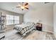 Spacious bedroom featuring vaulted ceilings, modern ceiling fan, and large window at 10002 Brittondale Ln, Charlotte, NC 28215