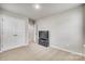 Bedroom featuring a closet with double doors and a modern TV stand on a light-colored carpet at 10002 Brittondale Ln, Charlotte, NC 28215
