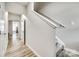 Inviting hallway features light wood flooring, access to other rooms, and staircase at 10002 Brittondale Ln, Charlotte, NC 28215