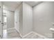 Hallway features practical storage space, durable flooring, and access to other rooms at 10002 Brittondale Ln, Charlotte, NC 28215