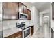 Well-equipped kitchen with stainless steel appliances, granite countertops, and tiled backsplash at 10002 Brittondale Ln, Charlotte, NC 28215