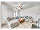 Spacious living room with ample seating, a ceiling fan, and easy access to other areas of the home at 10002 Brittondale Ln, Charlotte, NC 28215