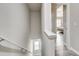 Bright staircase, with durable flooring, leads to the upper level, naturally lit by window at 10002 Brittondale Ln, Charlotte, NC 28215
