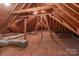 Unfinished attic space, great for storage, with exposed wood beams and ductwork at 104 Chalfont Ct, Salisbury, NC 28147
