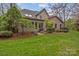 Expansive backyard features lush greenery, mature trees, and a well-maintained lawn at 104 Chalfont Ct, Salisbury, NC 28147