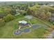 Aerial shot of a community pool, parking lot, tennis court, and grassy common area in neighborhood at 104 Chalfont Ct, Salisbury, NC 28147