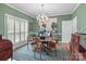 Charming dining room featuring hardwood floors, a classic chandelier, and elegant decor for memorable gatherings at 104 Chalfont Ct, Salisbury, NC 28147