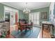 Inviting dining room with hardwood floors, chandelier, and traditional furnishings, perfect for Gathering meals and entertaining at 104 Chalfont Ct, Salisbury, NC 28147