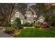 Charming brick home with manicured lawn and lush landscaping features a traditional design and inviting curb appeal at 104 Chalfont Ct, Salisbury, NC 28147