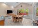 Eat-in kitchen with large windows, modern appliances, and breakfast table that seats four people at 104 Chalfont Ct, Salisbury, NC 28147