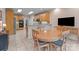 Open eat-in kitchen with modern stainless steel appliances, and a breakfast table that seats four people at 104 Chalfont Ct, Salisbury, NC 28147