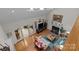 Bright living room boasts vaulted ceilings, a fireplace, and large sliding doors to a patio with ample natural light at 104 Chalfont Ct, Salisbury, NC 28147