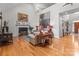 Spacious living room with a fireplace, hardwood floors, and plenty of natural light at 104 Chalfont Ct, Salisbury, NC 28147