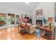 Cozy living room featuring a fireplace, hardwood floors, and sliding glass doors leading to a sunroom at 104 Chalfont Ct, Salisbury, NC 28147