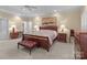 Bright main bedroom with tray ceilings, ceiling fan, and natural light at 104 Chalfont Ct, Salisbury, NC 28147