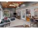 Bright sunroom with brick accent wall, wood ceilings and sliding glass doors to the living room at 104 Chalfont Ct, Salisbury, NC 28147