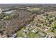Neighborhood aerial view featuring mature trees, lawns, and a view of green fields at 109 Connor Ct, Kings Mountain, NC 28086