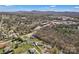 Wide aerial view of neighborhood showcasing homes, landscape, and distant mountain range at 109 Connor Ct, Kings Mountain, NC 28086